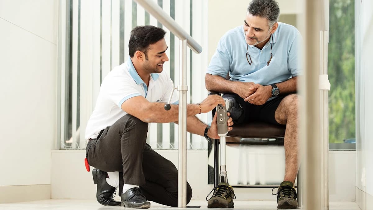 Prosthetist adjusting the Dynion knee with a tool