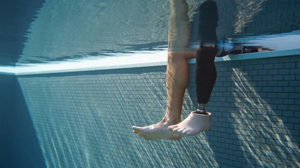 Underwater photo of an Evanto prosthetic foot in a swimming pool.