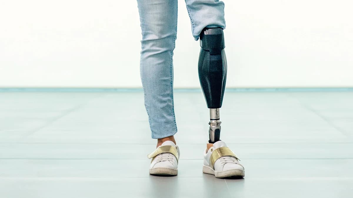 Prosthetic user reading a book