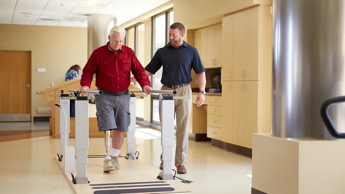 Prosthetic user during gait training indoors