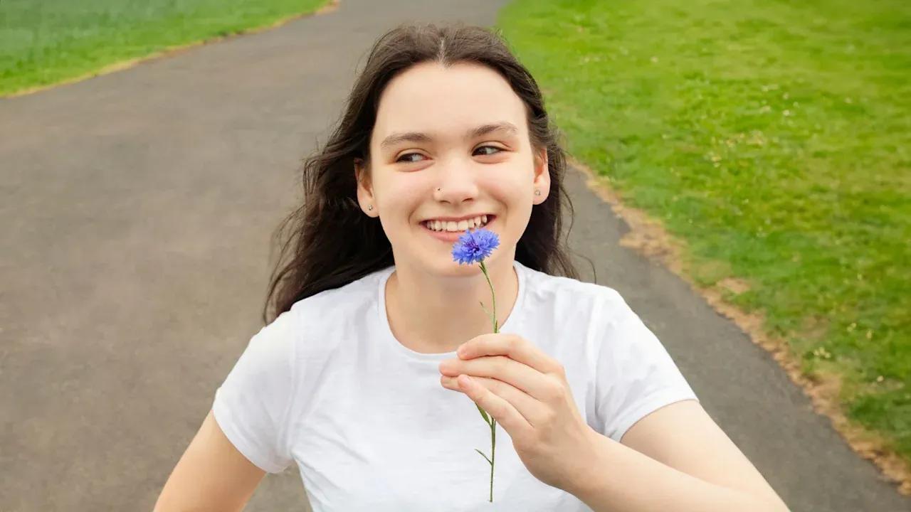 Cerebral Palsy patient is outside in the park.